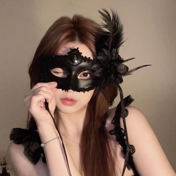 Elegant Black Lace Masquerade Mask with Feather Accent